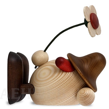 Eierkopf Oskar mit Blume liegend braun