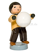 Boy carries snow ball brown