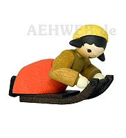 Girl lying on sledge stained