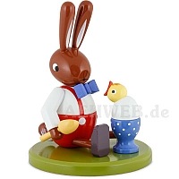 Easter bunny seated with egg and fledgling
