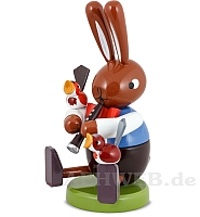 Easter bunny sitting with Clarinet and Birds