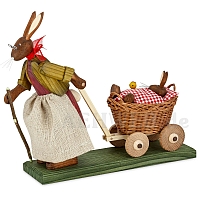 Easter Bunny Grandma with baby bunny in handcart with red blanket